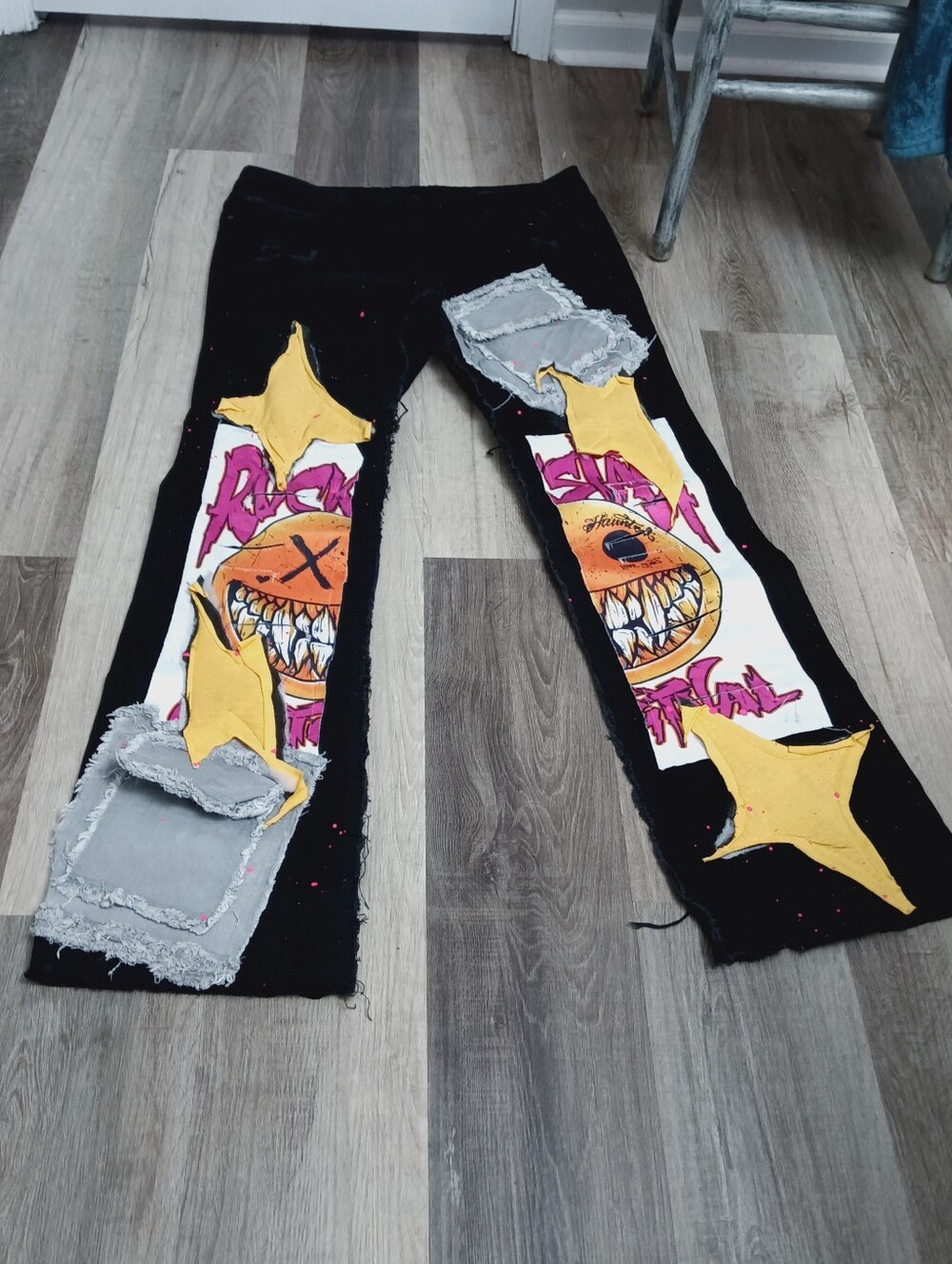 Black Rockstar Flare Graphic Distressed Patchwork Pants with Yellow Star Accents